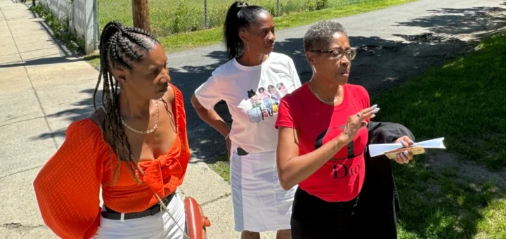 three daughters of James Saucer — Brenda Saucer, Tracee Carter and Pamela Saucer-Richardson — visit a property that their father used to own that the city of Boston has now given to a nonprofit organization to build affordable housing.