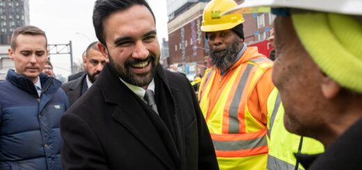 Zohran Mamdani greeting workers at the site of the Williamsburg Bridge bump. (Adam Gray / Bloomberg via Getty Images)